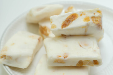 Traditional confections made with sugar or honey, roasted nuts and whipped egg whites