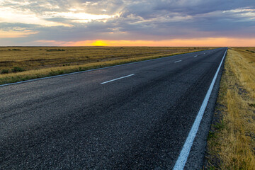 Sunset view of a road in russian steppe