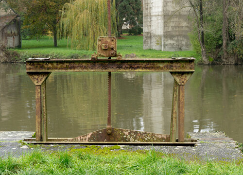 Abandoned and disused sluice gate on a river.
