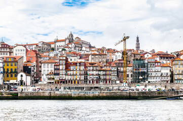 Fototapeta na wymiar It's Ribeira Quarter, Valley Douro, traditional sight, UNESCO World Heriatge site. View from the River Douro, one of the major rivers of the Iberian Peninsula (2157 m)