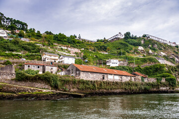 Fototapeta na wymiar It's Coast of the River Douro with its beautiful architecture in Porto, Portugal. View from the River Douro, one of the major rivers of the Iberian Peninsula (2157 m)