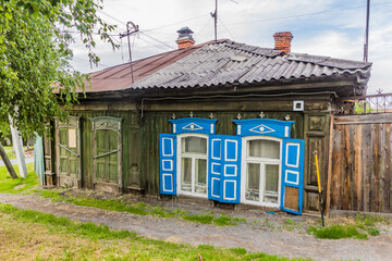 Typical old Russian wooden house in Tyumen city, Russia