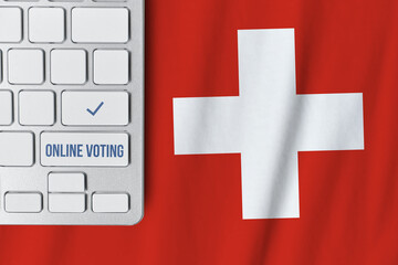 Online voting concept in Swiss Confederation. Keyboard near Switzerland country flag