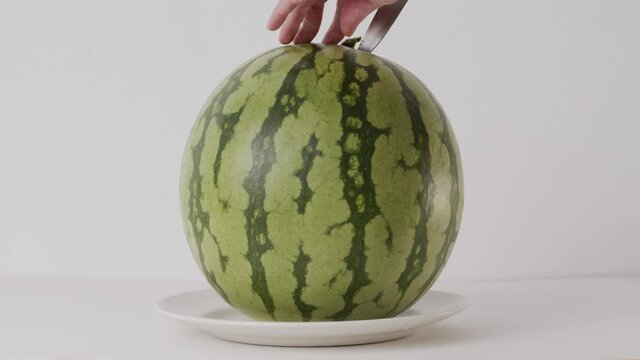 fresh juicy ripe watermelon cut with a knife on the table