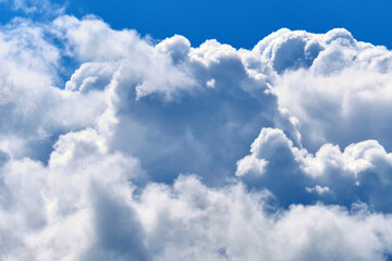 Fototapeta na wymiar Thick big clouds in the blue sky