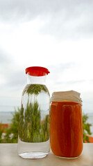 jar of apricot marmalade and pure water