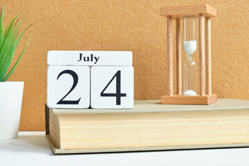 24th twenty fourth july month calendar concept on wooden blocks.