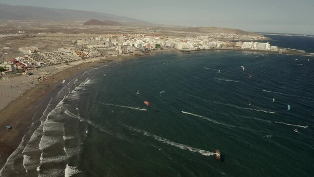 Bay with windsurfers and kiters. Tenerife, Spain