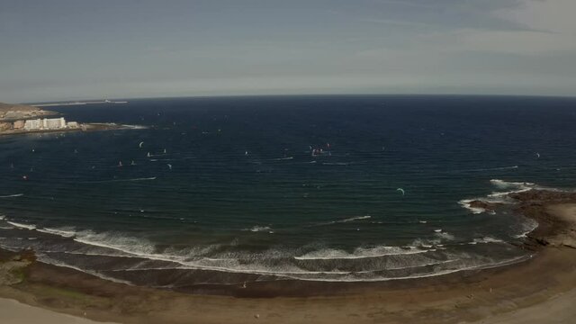 Bay with windsurfers and kiters. Tenerife, Spain