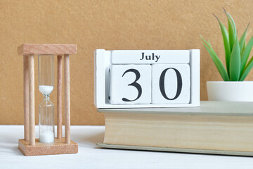 30th july - thirtieth day month calendar concept on wooden blocks.