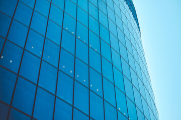 Business class modern glass building against the sky with toned