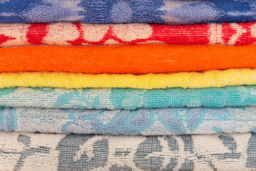 Stack of color terry towels. Fragment for background image.