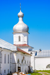It's St. George's (Yuriev) Monastery, Russia's oldest monastery. It is part of the World Heritage Site named Historic Monuments of Novgorod and Surroundings.