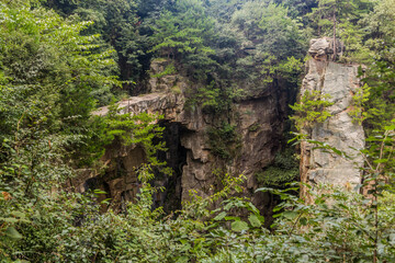 Fototapeta premium Rock bridge in Wulingyuan Scenic and Historic Interest Area in Zhangjiajie National Forest Park in Hunan province, China