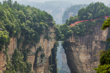Natural rock bridge in Wulingyuan Scenic and Historic Interest Area in Zhangjiajie National Forest...