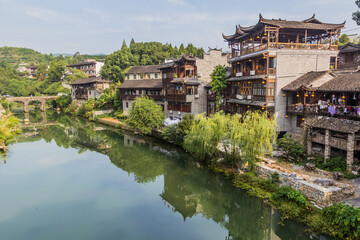 Obraz premium Traditional houses reflecting in a river in Furong Zhen town, Hunan province, China