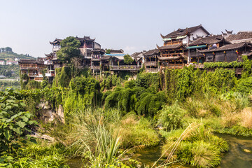 Fototapeta na wymiar Houses on cliffs in Furong Zhen town, Hunan province, China