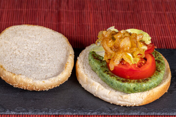 Vegan or vegetarian burger with spinach and potatoes. Healthy low calorie food, nutritious, with antioxidants, rich in folic acid and that improves intestinal transit. Ideal to take care of yourself