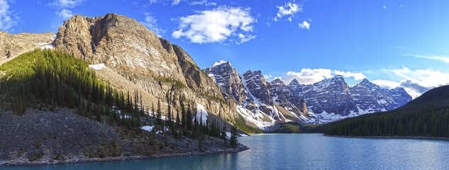 Wide Panoramic Landscape Scenery of Famous Moraine Lake and Rugged Alberta Mountain Peaks in...