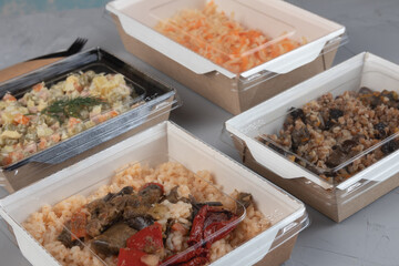 Food in eco packaging - lunch boxes for delivery.