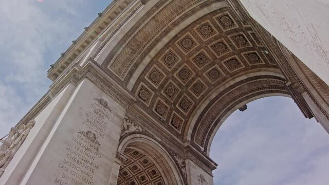 Under the Arc de Triomphe tilt up slow motion