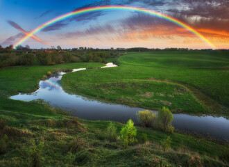 Landscape with a Rainbow on the River in Spring