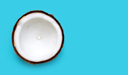 Half Coconut on blue background.