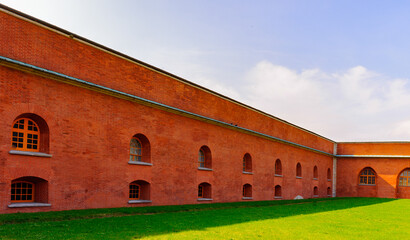 Fototapeta na wymiar Red brick wall of the Paul and Peter fortress in St. Petersburg