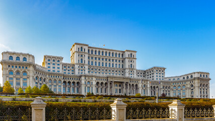 Fototapeta na wymiar It's Palace of the Parliament (Palatul Parlamentului), Bucharest, Romania. Palace is the world's largest civilian building with an administrative function and heaviest building.