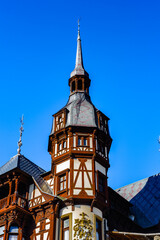 Obraz premium It's Tower of the Peles Castle, a Neo-Renaissance castle in the Carpathian Mountains of Romania