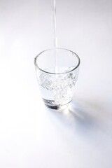 Water falling into glass