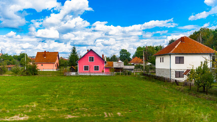 Fototapeta na wymiar It's Red roof house in the field of Serbia