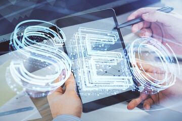 Multi exposure of man's hands holding and using a digital device and seo drawing. search...