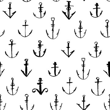 Seamless pattern with hand drawn anchors. Ink illustration. Isolated on white background. Marine ornament for wrapping paper.
