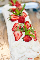 Freshly baked sweet strawberry Long-Cake Roll, also called Strawberry roulade