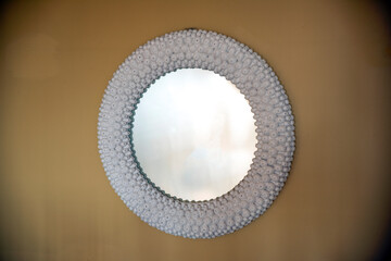 Circular mirror on the wall