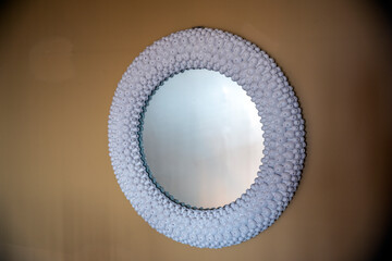 Circular mirror on the wall