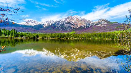 Fototapeta na wymiar Reflection of Pyramid Mountain in Pyramid Lake in Jasper National Park in Alberta, Canada. The mountains is part of the Victoria Cross Range in the Rocky Mountains
