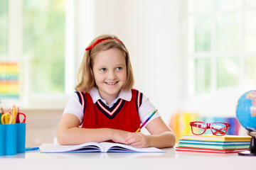 Kids doing homework. Children go back to school.