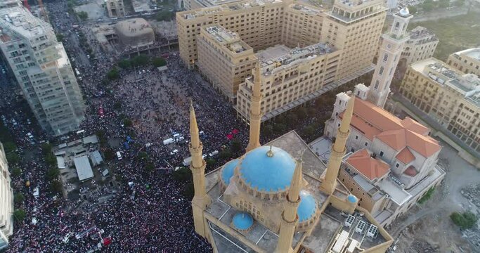 Beirut, Lebanon 2019 : day drone shot on road from Martyr square leading to Riad El Solh square with thousands of protesters revolting against government corruption during the Lebanese revolution