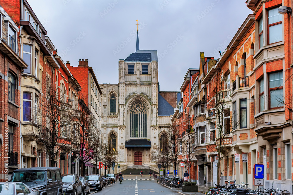 Wall mural view on medieval st peter's church and traditional brick houses in leuven, belgium