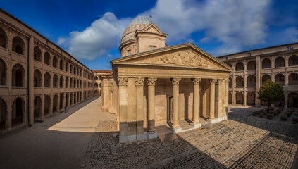 Panorama with the classical chapel and arcaded galleries in the courtyard of the cultural center of...