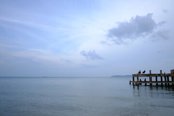 Fototapeta na wymiar landscape photography of concrete bridge leading to the sea photo in Haadson Beach thailand
