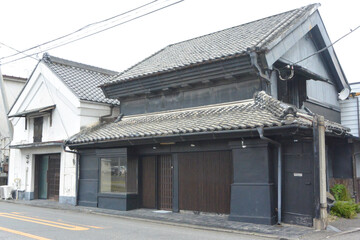 Fototapeta na wymiar Merchant house with warehouse made of earth and plaster on Nikko highway in Utsunomiya city, Tochigi prefecture.
