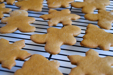 gingerbread cookie cutouts on a wire cooling rack