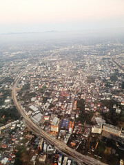 Fototapeta premium Aerial view of chiang mai city with buildings, roads and highway