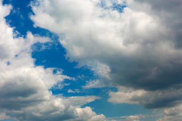 Gray clouds on blue sky background.