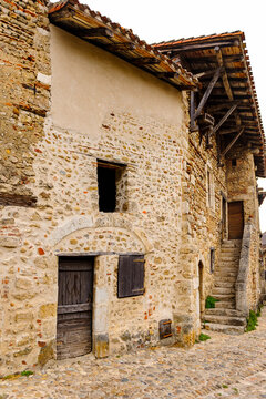 Old stone house in  Perouges, France, a medieval walled town, a popular touristic attraction.