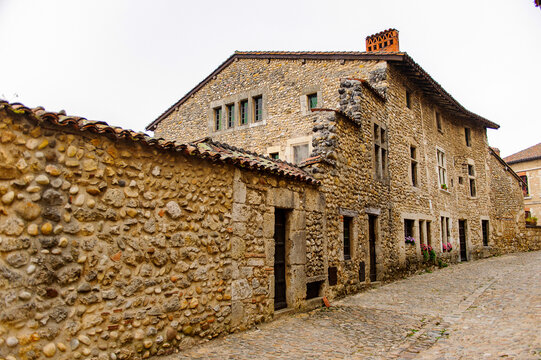 Narrow street in  Perouges, France, a medieval walled town, a popular touristic attraction.