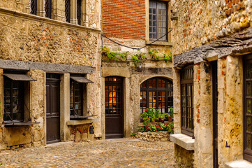 Fototapeta na wymiar Stone house of Perouges, France, a medieval walled town, a popular touristic attraction.